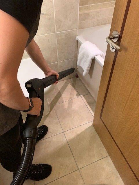 Matrix steam cleaner & vac in use tile cleaning